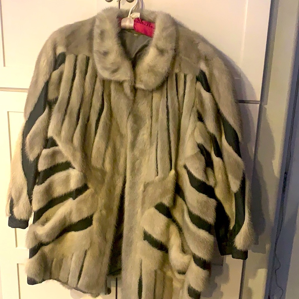Listing is for a leather and Mink fur coat by Stertz Furs.